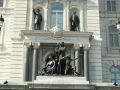 The bronze sculptures along the facade