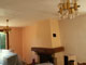 The fireplace gets painted peach, the walls apricot