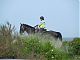 A mounted Gendarmette riding the dunes